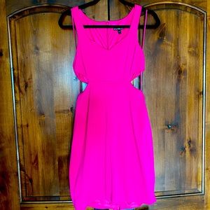 Express, neon pink mini dress with side cutouts.